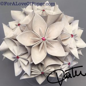 Paper flower bouquet made from cream colored paper with white pattern