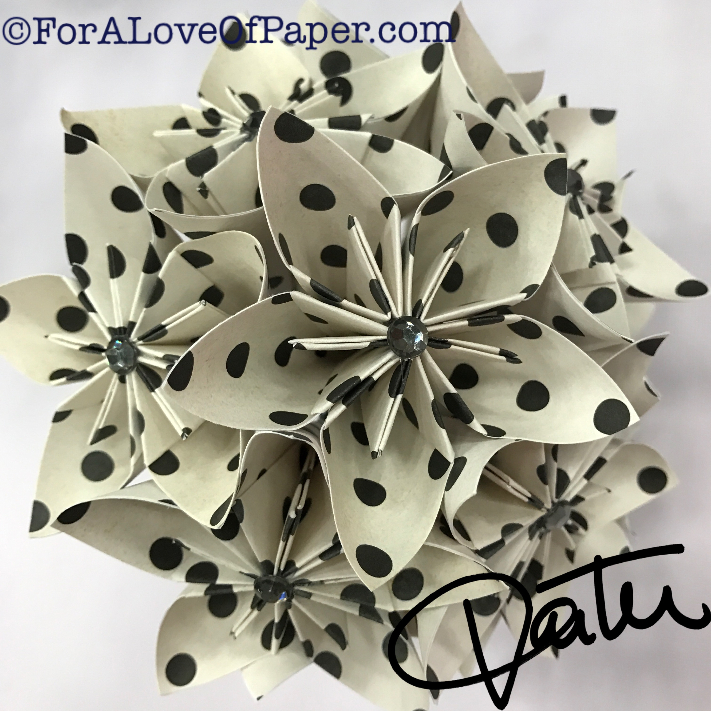 Paper flowers in classic dot themed scrapbook paper