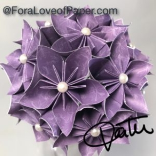 Paper flowers in purple dandelion themed scrapbook paper