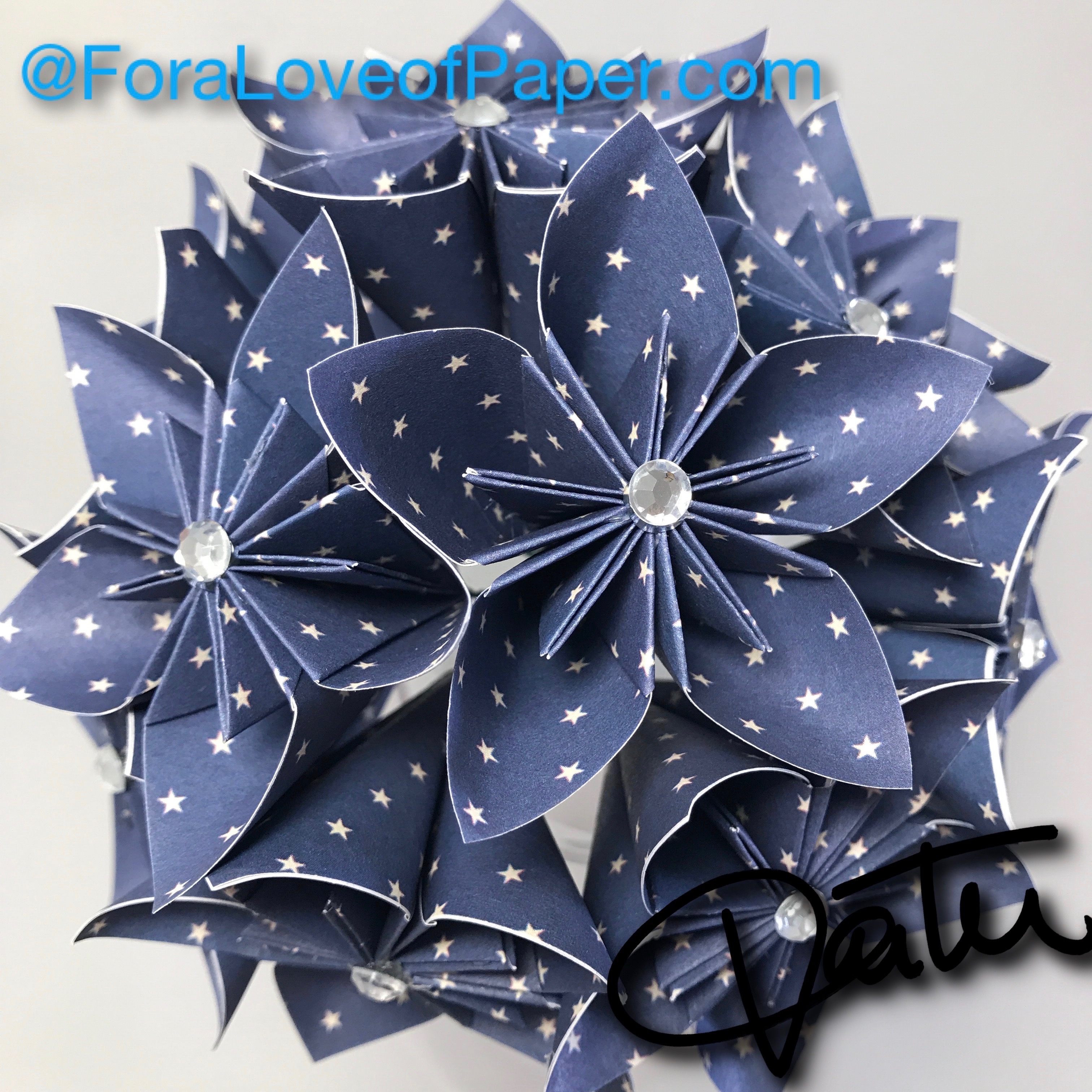 Paper flowers in tiny stars themed scrapbook paper